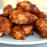 Golden-brown Kickin' Chicken baked in the oven.