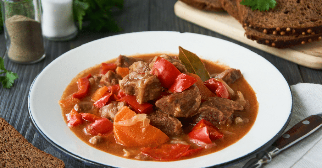 A hearty bowl of old-fashioned beef stew with tomatoes