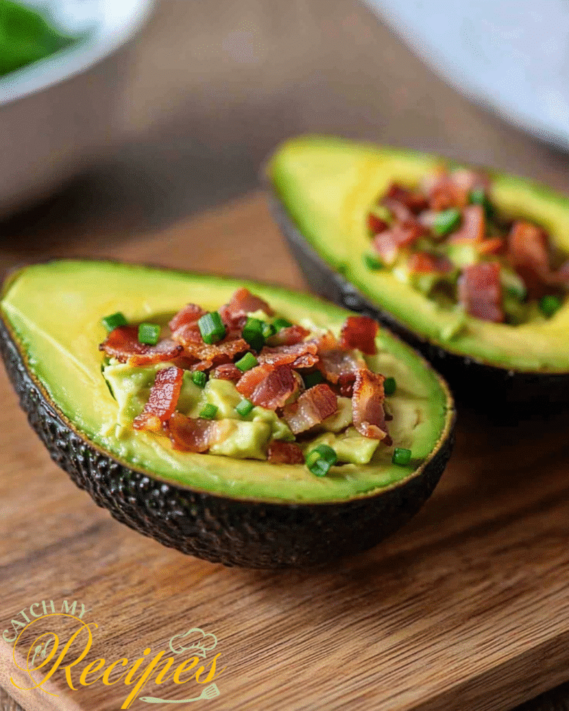 10 Easy Recipes to Make During a Power Outage (No Cooking Needed) 8 Halved avocados filled with chopped bacon and green onions on a wooden board