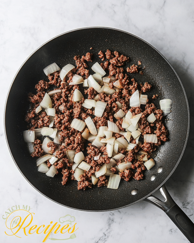Beef Stroganoff With Potatoes Recipe | 30-Minute Dinner 5 Cooked ground beef and diced onions in a non-stick skillet - Step 3